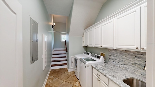10809 Arrowtree Blvd, Clermont, FL 34715 - washroom featuring cabinet space, washer and clothes dryer, and baseboards
