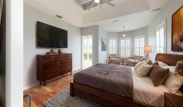 10809 Arrowtree Blvd, Clermont, FL 34715 - bedroom with light wood-style flooring, multiple windows, baseboards, and a ceiling fan