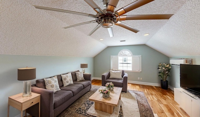 10809 Arrowtree Blvd, Clermont, FL 34715 - living room featuring a textured ceiling, light wood-style flooring, baseboards, lofted ceiling, and ceiling fan