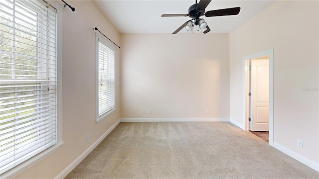 10809 Arrowtree Blvd, Clermont, FL 34715 - spare room with light carpet, healthy amount of natural light, baseboards, and a ceiling fan