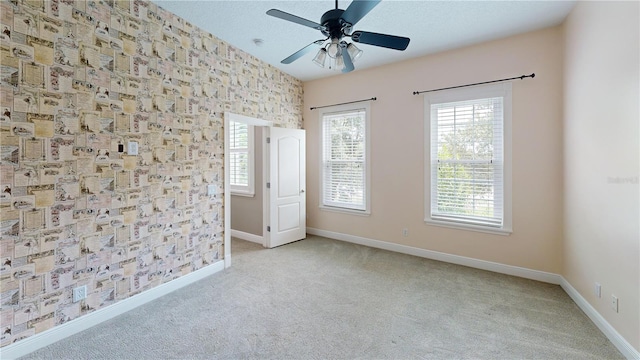 10809 Arrowtree Blvd, Clermont, FL 34715 - carpeted spare room with baseboards, plenty of natural light, and a ceiling fan