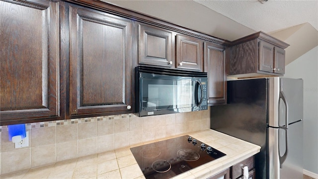 10809 Arrowtree Blvd, Clermont, FL 34715 - kitchen featuring black appliances, tile countertops, dark brown cabinets, and backsplash