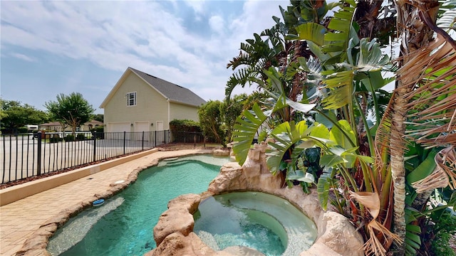 10809 Arrowtree Blvd, Clermont, FL 34715 - view of swimming pool with a fenced backyard and an in-ground hot tub
