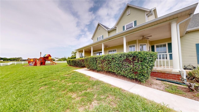 10809 Arrowtree Blvd, Clermont, FL 34715 - view of yard featuring ceiling fan and a playground
