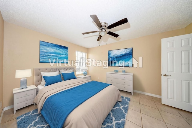 420 Forestway Cir Unit 206, Altamonte Springs, FL 32701 - bedroom featuring light tile patterned flooring, a ceiling fan, baseboards, and a textured ceiling