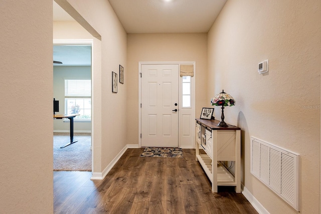 5416 Tessin Trl, Saint Cloud, FL 34771 - foyer with dark wood finished floors, baseboards, and a textured wall