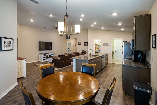 5416 Tessin Trl, Saint Cloud, FL 34771 - dining space with baseboards, dark wood-style flooring, lofted ceiling, and recessed lighting