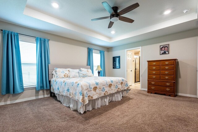 5416 Tessin Trl, Saint Cloud, FL 34771 - carpeted bedroom with a tray ceiling, baseboards, recessed lighting, and ceiling fan