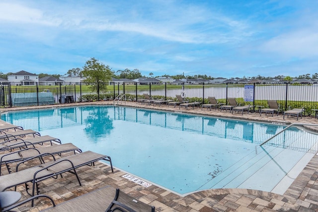 5416 Tessin Trl, Saint Cloud, FL 34771 - community pool with a residential view and a patio
