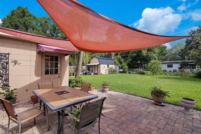 3405 Werber St, Orlando, FL 32806 - view of patio with outdoor dining area and an outdoor structure
