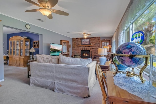 3405 Werber St, Orlando, FL 32806 - living room featuring ceiling fan, carpet floors, a fireplace, and crown molding
