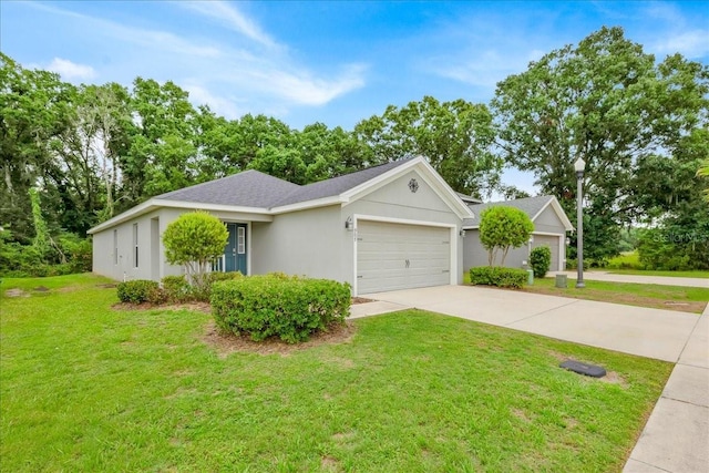 907 Pearly Ridge Ln, Lakeland, FL 33809 - ranch-style home with an attached garage, concrete driveway, a front lawn, stucco siding, and a shingled roof
