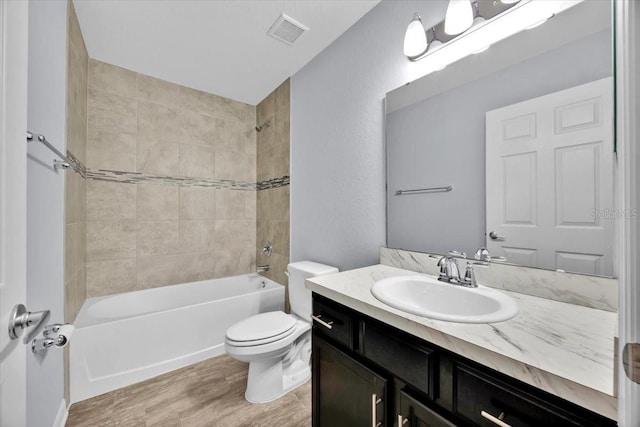 907 Pearly Ridge Ln, Lakeland, FL 33809 - full bath with vanity, wood finished floors, toilet, and shower / bath combination