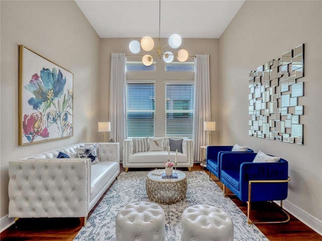8047 Chilton Dr, Orlando, FL 32836 - living room featuring wood finished floors, a chandelier, and baseboards