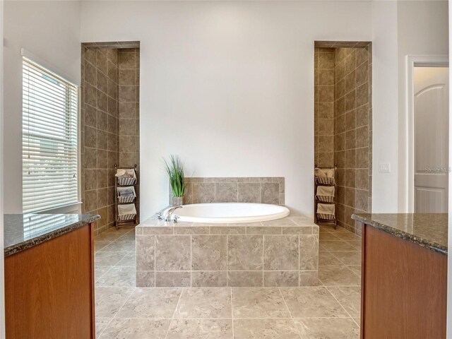 8047 Chilton Dr, Orlando, FL 32836 - bathroom with a garden tub, tile patterned floors, and vanity