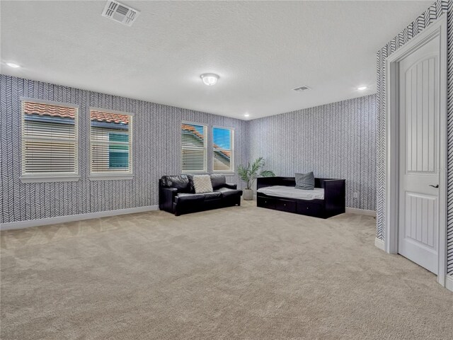 8047 Chilton Dr, Orlando, FL 32836 - living room featuring wallpapered walls, carpet floors, baseboards, and a textured ceiling