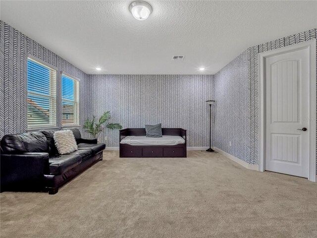 8047 Chilton Dr, Orlando, FL 32836 - carpeted living room with wallpapered walls, a textured ceiling, and baseboards