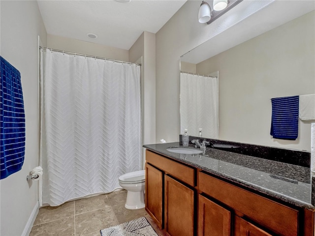 8047 Chilton Dr, Orlando, FL 32836 - full bathroom featuring toilet, vanity, tile patterned floors, baseboards, and curtained shower