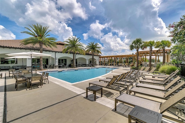 8047 Chilton Dr, Orlando, FL 32836 - community pool featuring a patio