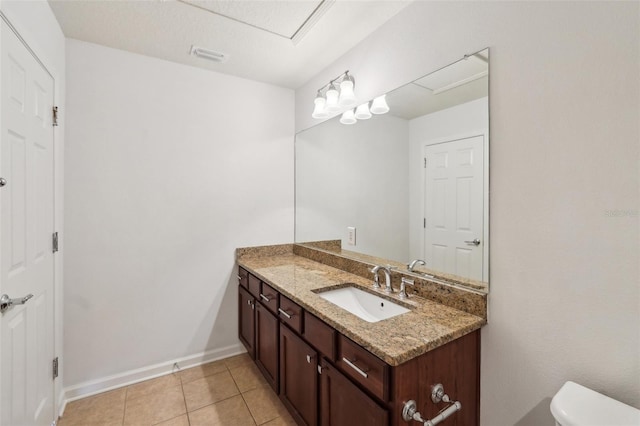 10124 Westpark Preserve Blvd, Tampa, FL 33625 - bathroom featuring vanity, toilet, tile patterned floors, and baseboards
