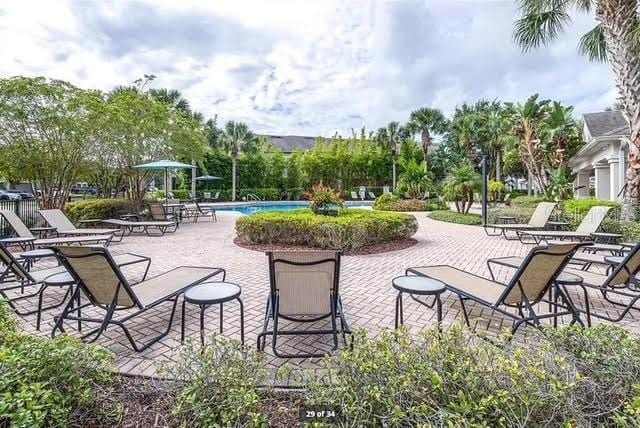 10124 Westpark Preserve Blvd, Tampa, FL 33625 - view of patio / terrace featuring a community pool