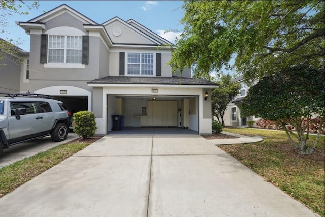 10124 Westpark Preserve Blvd, Tampa, FL 33625 - view of front of house featuring stucco siding, an attached garage, and driveway