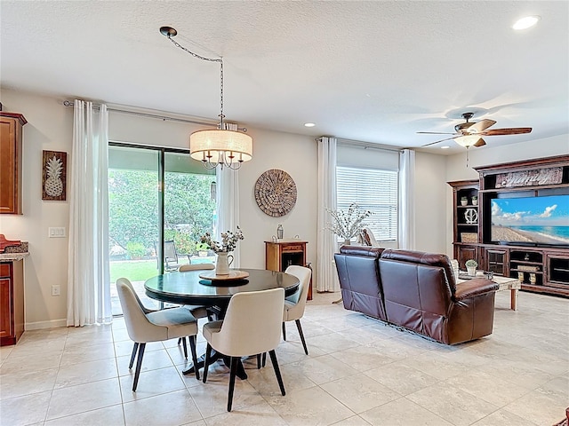 dining area with plenty of natural light, recessed lighting, light tile patterned floors, a chandelier, and ceiling fan