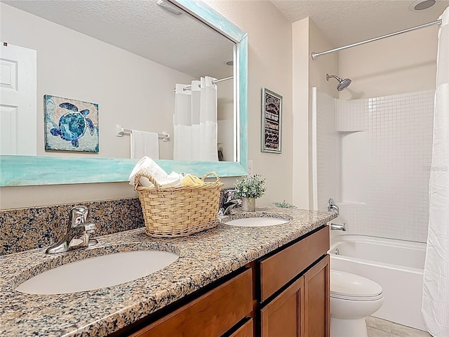 bathroom with double vanity, shower / tub combo, toilet, a textured ceiling, and tile patterned floors