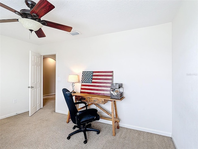 office featuring carpet, ceiling fan, and baseboards