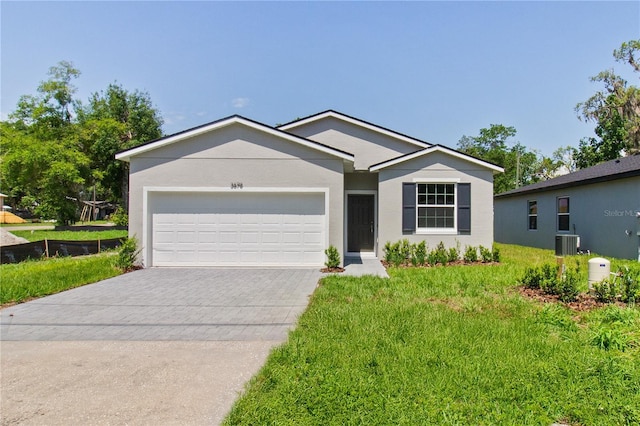 3678 Rollin O Ln, Apopka, FL 32703 - ranch-style home with central AC unit, driveway, an attached garage, a front lawn, and stucco siding