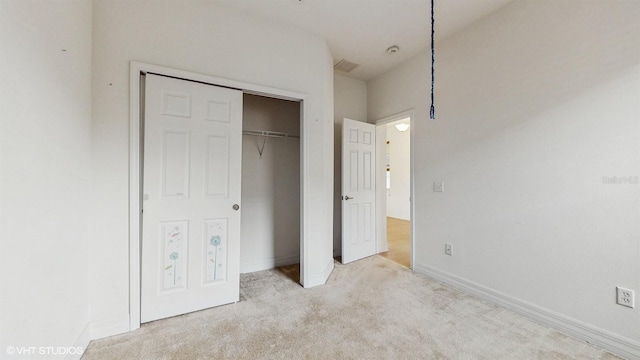 579 Setting Sun Dr, Winter Garden, FL 34787 - unfurnished bedroom featuring carpet, a closet, and baseboards