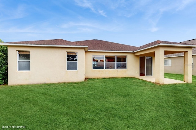 579 Setting Sun Dr, Winter Garden, FL 34787 - back of property featuring a lawn, stucco siding, a shingled roof, and a patio