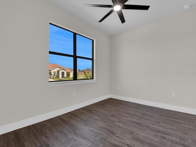 9257 King Hill St, Port Charlotte, FL 33981 - unfurnished room featuring dark wood finished floors, a ceiling fan, and a smoke detector