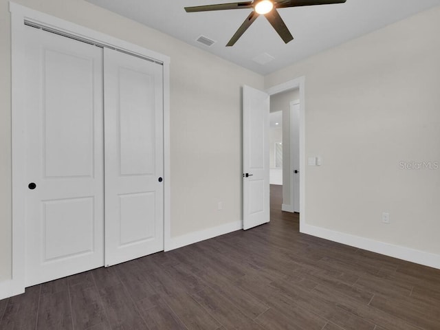 9257 King Hill St, Port Charlotte, FL 33981 - unfurnished bedroom featuring dark wood-type flooring, a closet, and ceiling fan