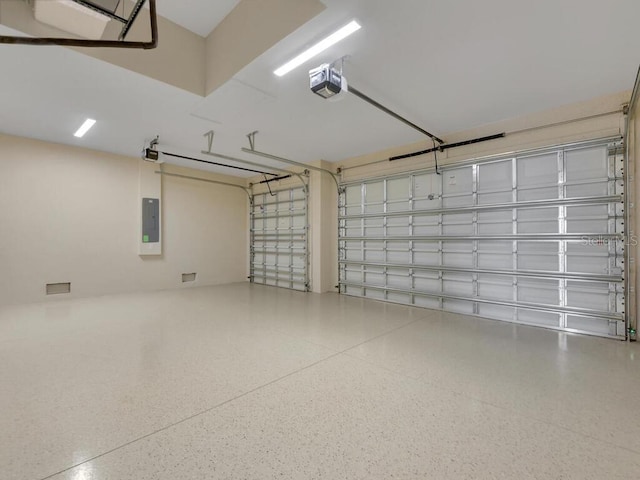 9257 King Hill St, Port Charlotte, FL 33981 - garage with a garage door opener and electric panel