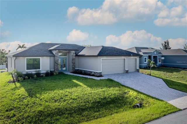 9257 King Hill St, Port Charlotte, FL 33981 - view of front facade with an attached garage, decorative driveway, a front yard, stucco siding, and stone siding