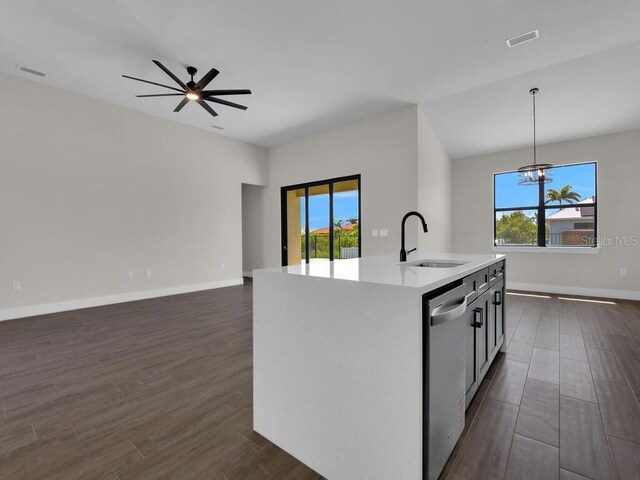 9257 King Hill St, Port Charlotte, FL 33981 - kitchen featuring stainless steel dishwasher, plenty of natural light, light countertops, and dark wood-style floors