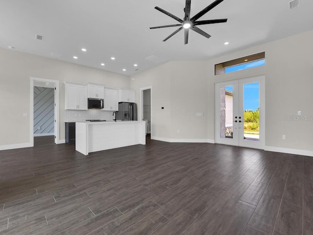 9257 King Hill St, Port Charlotte, FL 33981 - unfurnished living room with french doors, dark wood-style floors, ceiling fan, and recessed lighting