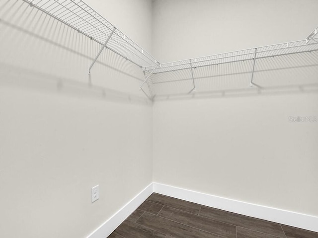 9257 King Hill St, Port Charlotte, FL 33981 - spacious closet featuring dark wood-style flooring