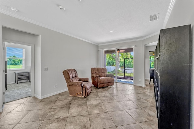 2681 Cabernet Cir, Ocoee, FL 34761 - living area featuring plenty of natural light, crown molding, baseboards, light tile patterned floors, and a textured ceiling