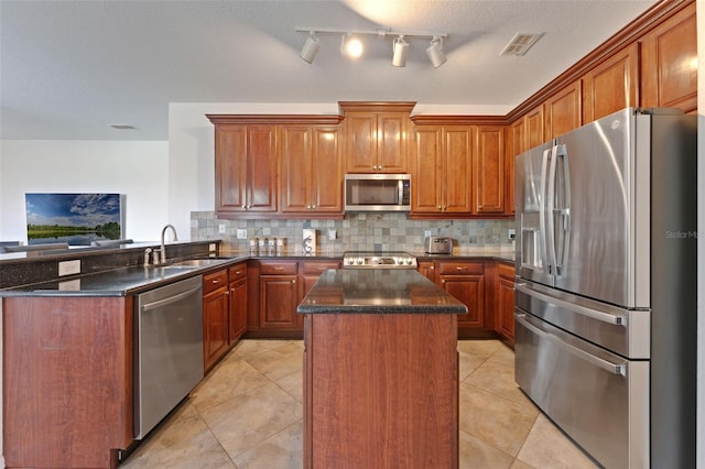 2681 Cabernet Cir, Ocoee, FL 34761 - kitchen with appliances with stainless steel finishes, a center island, decorative backsplash, and a peninsula