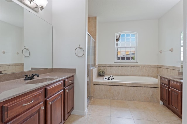 2681 Cabernet Cir, Ocoee, FL 34761 - full bathroom with vanity, a garden tub, a stall shower, and tile patterned flooring
