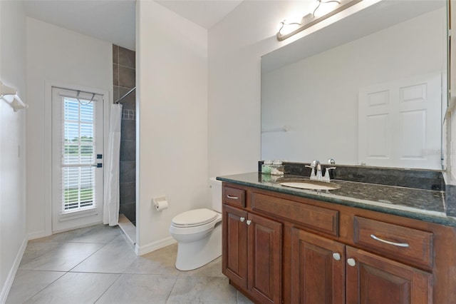 2681 Cabernet Cir, Ocoee, FL 34761 - bathroom featuring vanity, toilet, tiled shower, and baseboards