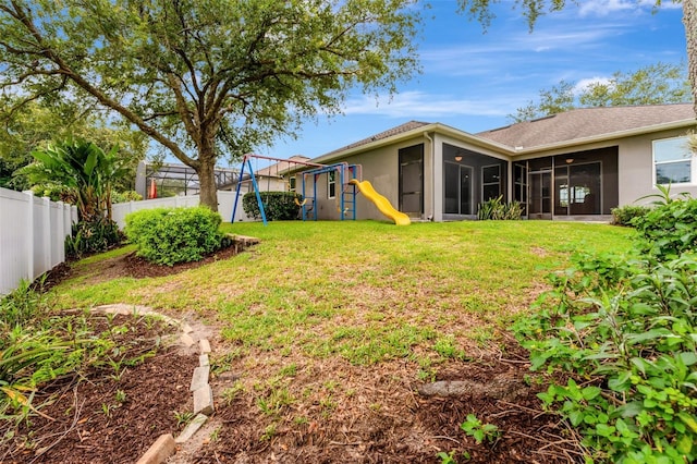 2681 Cabernet Cir, Ocoee, FL 34761 - view of yard with a playground and a sunroom