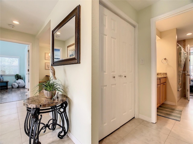 135 Florida Blvd, Crystal Beach, FL 34681 - hall with light tile patterned floors, baseboards, and recessed lighting