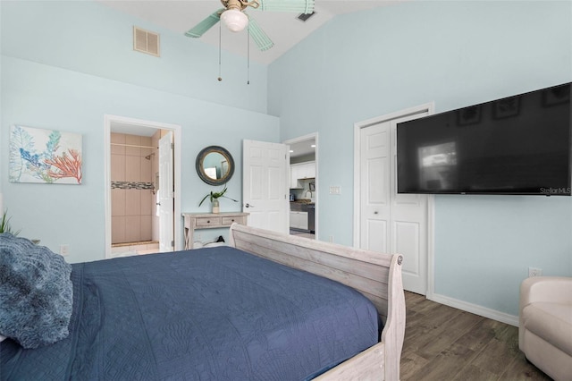 135 Florida Blvd, Crystal Beach, FL 34681 - bedroom featuring wood finished floors, baseboards, high vaulted ceiling, ceiling fan, and connected bathroom