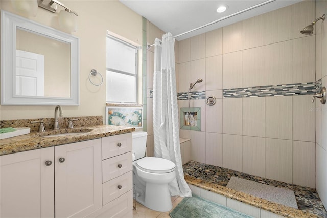 135 Florida Blvd, Crystal Beach, FL 34681 - full bathroom with a tile shower, vanity, toilet, and tile patterned floors