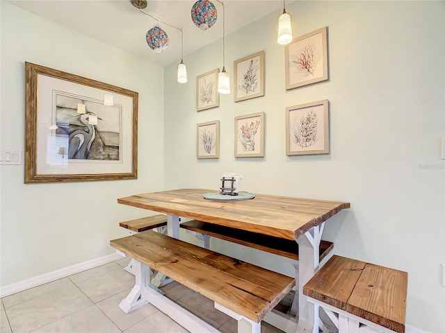 135 Florida Blvd, Crystal Beach, FL 34681 - dining space featuring light tile patterned floors and baseboards