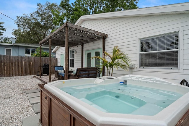 135 Florida Blvd, Crystal Beach, FL 34681 - view of patio / terrace featuring a hot tub, a pergola, and french doors