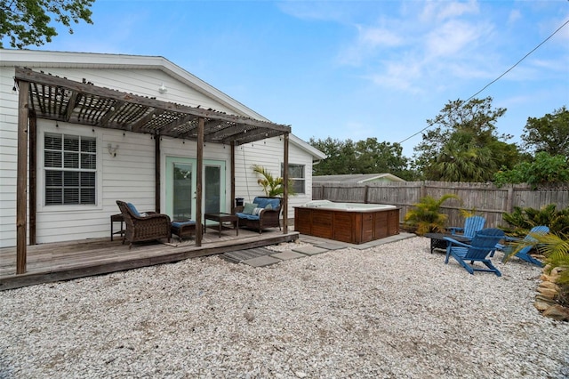 135 Florida Blvd, Crystal Beach, FL 34681 - rear view of property featuring a hot tub, a fenced backyard, a deck, an outdoor living space, and a pergola